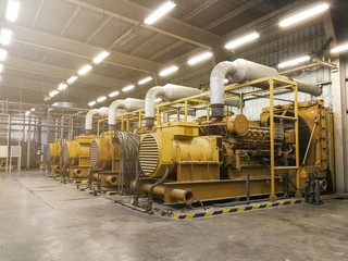 large yellow generators in a warehouse setting